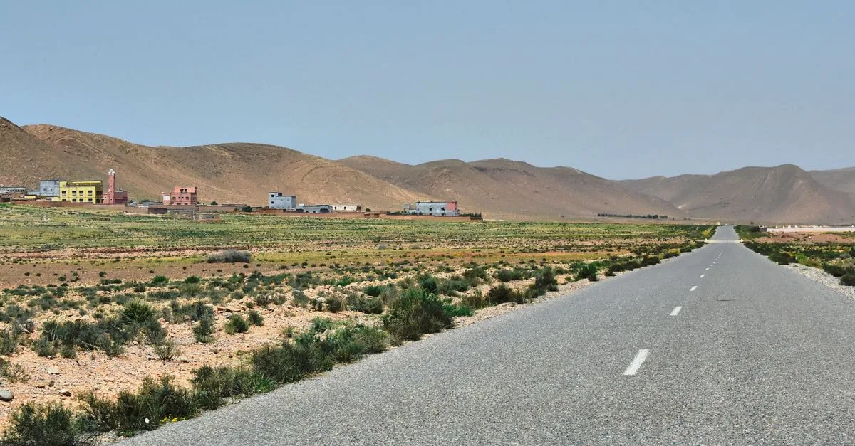Captivating landscape view of Irherm village, mountains, and road in Souss-Massa, Morocco.
